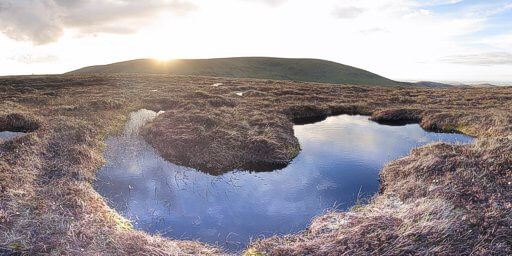 Sunset over The Chiviot, and a pool on Comb Fell.