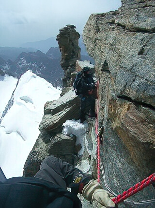 Climbers on the exposed traverse to the Madonna Summit, Gran Paradiso, Italy. © Derek Stillingfleet Climbers on the exposed traverse to the Madonna Summit, Gran Paradiso, Italy. © Derek Stillingfleet