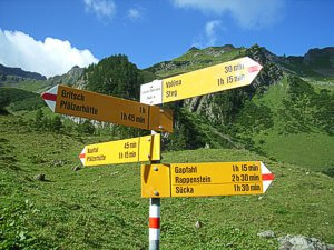 Yellow sign posts will help guide you for a while. Yellow signpost.